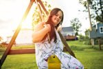 Portrait of trisomie 21 adult girl outside at sunset