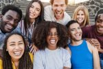 Young diverse people having fun outdoor laughing together