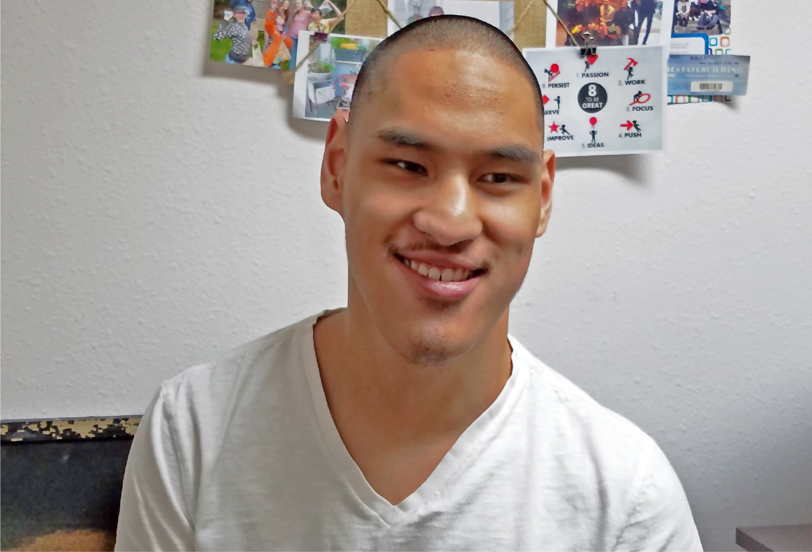 Young Man posing in front of the camera smiling